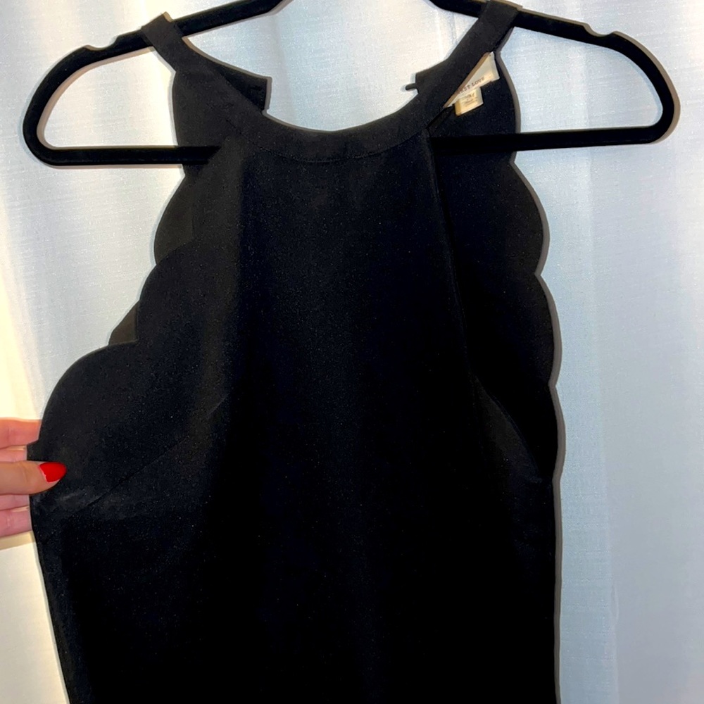 Women’s black dress with scalloped side